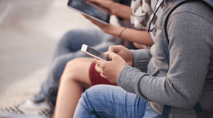 people using smartphones showing cpted cyber security for commercial places